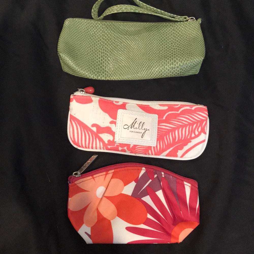 Three small Clinique makeup bags